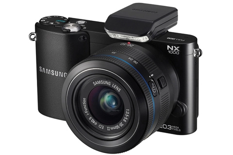 Samsung nx1000 bán ra sau một tháng chậm trễ - 1