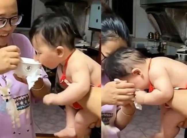 Bé gái yếm đỏ mũm mĩm đốn tim nhiều người vì háu ăn giật cả bát từ tay mẹ - 2