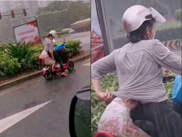 Trời mưa tầm tã hành động của mẹ trẻ làm người qua đường ai cũng ngoái lại nhìn - 1