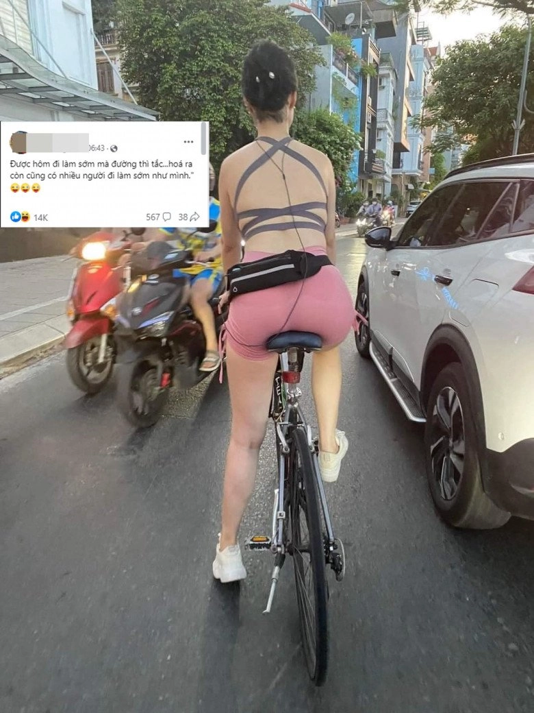 Người phụ nữ đạp xe mặc đồ bó sát khoe trọn tấm lưng làm tắc cả đoạn đường hồ tây - 1